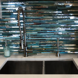 linear glass mosaic backsplash in green and mirror by allison eden studios